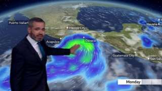 Ben Rich stands in front of a weather map showing a storm moving close to the coast of Mexico