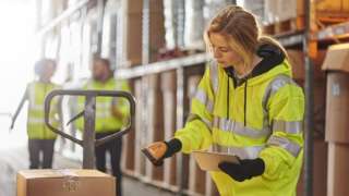 young woman working in a warehouse