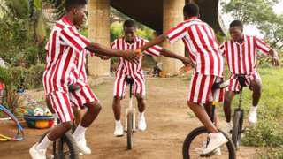 Street children practice acrobatics on unicycles in Lagos, Nigeria - Monday 14 August 2023