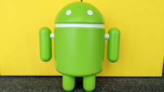 A photo of a 3d version of the android robot logo