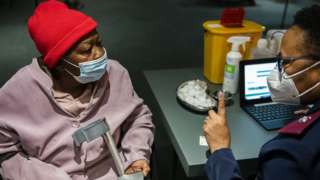 An elderly woman waiting to receive Covid-19 vaccine
