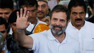 Rahul Gandhi, a senior leader of India"s main opposition Congress party, waves towards his party supporters as he arrives at the New Delhi airport, after he appeared before a court in Surat in the western state of Gujarat, India, March 23, 2023.