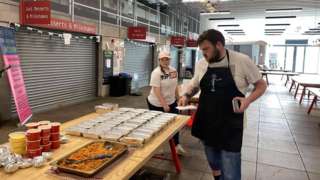 Volunteers make meals