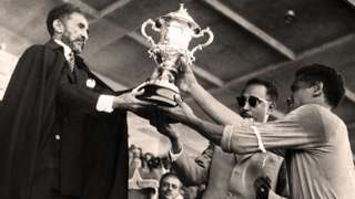 Ethiopia captain Luciano Vassallo receives the Nations Cup from Emperor Haile Selassie