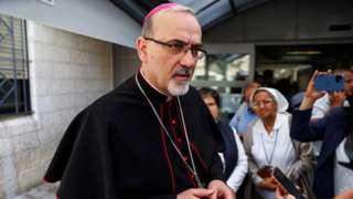 Latin Patriarch Archbishop Pierbattista Pizzaballa speaks to reporters following a press conference at St Joseph Hospital in Jerusalem on 16 May 2022