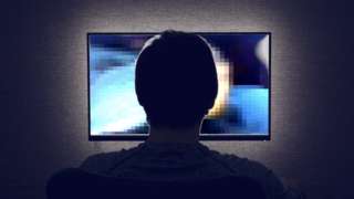 man looking at explicit video