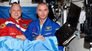 From left to right: Russian cosmonauts Oleg Artemyev and Denis Matveev