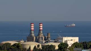 An oil tanker carrying fuel oil from Iraq, is seen anchored near the Zahrani power plant in Zahrani near the southern Lebanese city of Sidon (Saida) on September 18, 2021. -