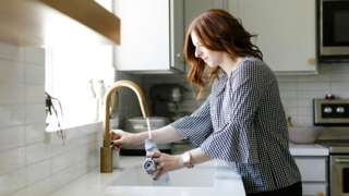 Woman at sink