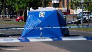 A police tent at the scene on College Road, Kingstanding, north of Birmingham,