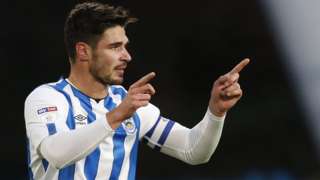 Christopher Schindler celebrates his first-half goal for Huddersfield Town against Nottingham Forest