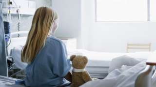 Child in a hospital bed (generic image)