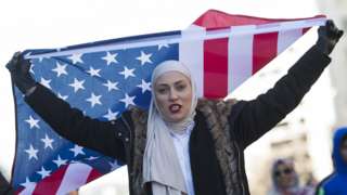 A woman protests against US President Donald Trump in Washington DC on 4 February 2017