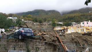 Damaged land and a misplaced car on Ischia