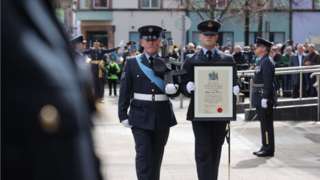 The ceremonial certificate being paraded to members of the Royal Air Force