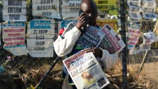 A newspaper seller in Harare on 7 September 2019, following the death of former president Robert Mugabe