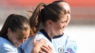 Chelsea players celebrate Maren Mjelde's penalty