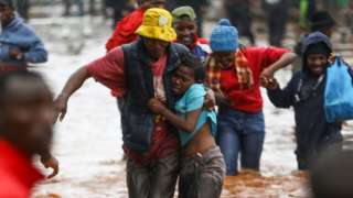 Locals rescue stranded residents who were trapped in their flooded homes in Nairobi