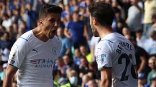Manchester City's Bernardo Silva celebrates scoring his side's goal with Rodri against Leicester City