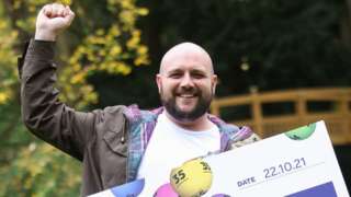 Lottery winner Sean Irwin, from Brentwood, celebrating his £300,000 win