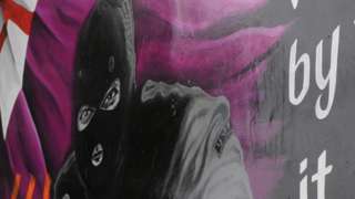 Mural depicting masked paramilitary gunman