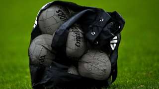 Gaelic footballs in a bag