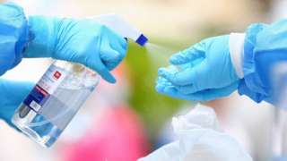 Medical workers disinfect their hands in Shanghai.