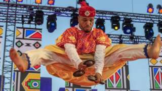A member of the Moallem Houssem Ghina Ensemble performs onstage during the 24th edition of the Gnaoua World Music Festival in Essaouira, Morocco, 23 June 2023