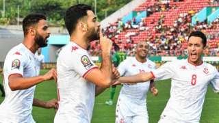 Hamza Mathlouthi celebrates his opening goal for Tunisia