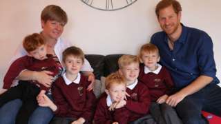 Prince Harry with Oliver Rooney and his family