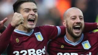 Jack Grealish and Alan Hutton celebrate