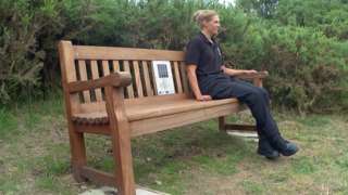 Woman sat on sonic bench