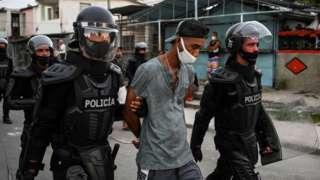 A man is arrested during a demonstration against the government of President Miguel Diaz-Canel in Arroyo Naranjo Municipality, Havana on July 12, 2021.