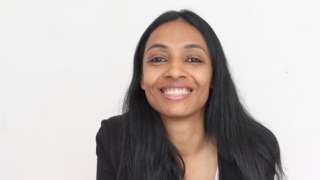 Pallavi on pink sofa