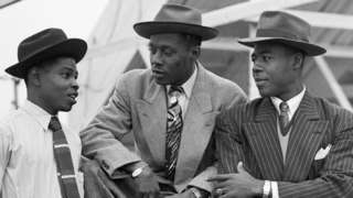 Three Jamaican immigrants on board the Empire Windrush ship in 1948