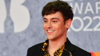 Tom Daley poses on the red carpet