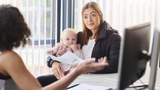 Mother with small child getting financial advice