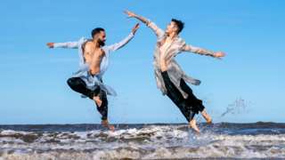 Aakash Odedra Company performers, Aakash Odedra and Hu Shenyuan dance selected extracts from their duet Samsara on Portobello Beach in Edinburgh during a media call for their performance at the Edinburgh International Festival. 17 August 2022