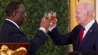 US President Joe Biden (R) and President of Senegal Macky Sall (L) offer toasts at the US-Africa Leaders Summit dinner in the East Room of the White House in Washington, DC, USA, 14 December 2022.