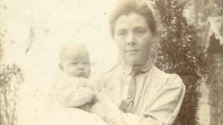 Olive with her son, John, in a garden