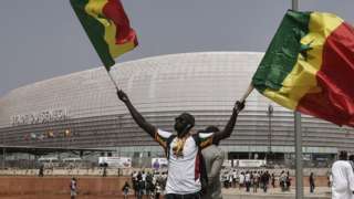 A Senegal fan outside the country's new stadium