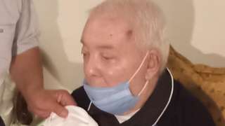 Maher's grandfather in a mask