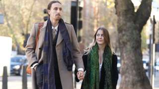 Eben Lazarus and Hannah Hunt holding hands as they arrive at Westminster Magistrates Court on 6 December.
