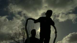 Child playing in silhouette
