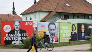 Posters showing Germany"s top candidates for the upcoming federal elections