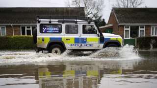 Police vehicle in flood