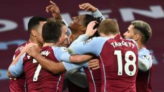 Aston Villa players celebrate after scoring against Crystal Palace in the Premier League
