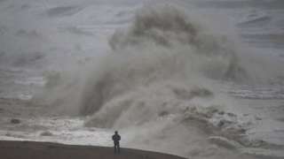 Waves crash on to the beach and cliffs, on November 02, 2023 in West Bay, Dorset.