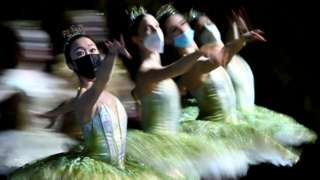 Dancers from the Berlin State Ballet - Staatsballett Berlin - wear face masks as they perform during the dress rehearsal of Don Quixote at the Deutsche Oper opera house in Berlin, Germany, on 1 December 2021