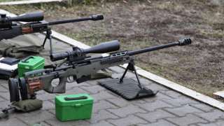 Two sniper rifles at a shooting range